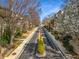 Scenic street lined with upscale townhomes and lush greenery at 2009 Kensington Green Se Dr, Smyrna, GA 30080