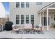 Backyard patio seating area with outdoor furniture and covered patio at 3810 Branch Bluff Ln, Cumming, GA 30040