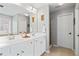 Bright bathroom featuring double vanity and shower, designed with style and function at 3810 Branch Bluff Ln, Cumming, GA 30040