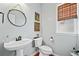 Charming powder room with a unique vanity and decorative mirror at 3810 Branch Bluff Ln, Cumming, GA 30040
