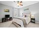 Comfortable bedroom with neutral tones, plush bedding, and ample natural light at 3810 Branch Bluff Ln, Cumming, GA 30040