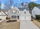 Charming two-story home with stone accents, a covered porch, and a two-car garage at 3810 Branch Bluff Ln, Cumming, GA 30040
