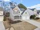 Attractive two-story home featuring stone accents, a manicured lawn, and a two-car garage at 3810 Branch Bluff Ln, Cumming, GA 30040