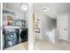 Upstairs hallway with laundry area and bedroom access, offering a convenient layout at 3810 Branch Bluff Ln, Cumming, GA 30040