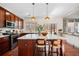 Lovely kitchen with an expansive island, pendant lighting and backyard view at 3810 Branch Bluff Ln, Cumming, GA 30040