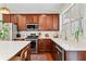 Bright kitchen with wood cabinets, stainless steel appliances, and elegant countertops at 3810 Branch Bluff Ln, Cumming, GA 30040