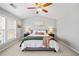 Comfortable main bedroom with ample natural light and a relaxing, neutral color scheme at 3810 Branch Bluff Ln, Cumming, GA 30040