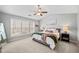 Serene main bedroom with large windows, vaulted ceiling, and neutral tones for a relaxing retreat at 3810 Branch Bluff Ln, Cumming, GA 30040
