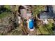 Aerial view of a backyard with a pool and patio, connecting to the main house at 4570 Nantucket Sw Dr, Lilburn, GA 30047