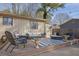 Backyard deck featuring outdoor seating, fire pit, and stylish decor, perfect for entertaining and relaxation at 4570 Nantucket Sw Dr, Lilburn, GA 30047