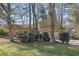 Inviting exterior view of the two-story home with mature trees and well-maintained landscaping at 4570 Nantucket Sw Dr, Lilburn, GA 30047