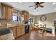 Inviting eat-in kitchen features wood cabinetry, granite counters, breakfast nook, and stainless-steel appliances at 4570 Nantucket Sw Dr, Lilburn, GA 30047