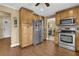 Bright kitchen featuring custom wood cabinets, stainless steel appliances and tile flooring at 4570 Nantucket Sw Dr, Lilburn, GA 30047