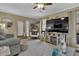 Stylish living room featuring ample seating, a modern rug, and neutral colors at 4570 Nantucket Sw Dr, Lilburn, GA 30047