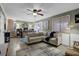 Cozy living room with exposed brick, large sectional sofa, and a decorative area rug at 4570 Nantucket Sw Dr, Lilburn, GA 30047