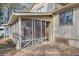 Exterior view of screened porch, with stone patio, offering an inviting outdoor living space at 4570 Nantucket Sw Dr, Lilburn, GA 30047