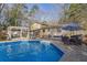 Inviting backyard with a sparkling pool, dining area, and a well-maintained lawn, ideal for outdoor enjoyment at 4570 Nantucket Sw Dr, Lilburn, GA 30047
