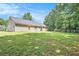 Large fenced backyard with a well-maintained lawn at 60 Cypress Dr, Covington, GA 30016