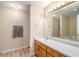 Bathroom featuring a large mirror, vanity, and a separate water closet at 60 Cypress Dr, Covington, GA 30016