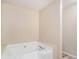 Bright bathroom featuring a garden tub at 60 Cypress Dr, Covington, GA 30016