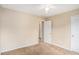 Bedroom with carpet flooring, neutral walls, and a view of the bedroom across the hall at 60 Cypress Dr, Covington, GA 30016