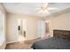 Bedroom view featuring a tray ceiling and an attached ensuite bathroom at 60 Cypress Dr, Covington, GA 30016
