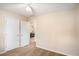 Bedroom with neutral walls, carpet flooring, and a view of the primary bedroom at 60 Cypress Dr, Covington, GA 30016