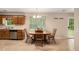 Kitchen with stainless steel appliances and an adjacent dining area at 60 Cypress Dr, Covington, GA 30016