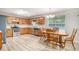 Kitchen/dining combo with stainless steel appliances and wood cabinetry at 60 Cypress Dr, Covington, GA 30016
