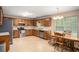 Spacious kitchen with stainless steel appliances and a dining area at 60 Cypress Dr, Covington, GA 30016