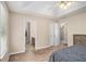 Spacious main bedroom features carpeted floors, a ceiling fan, and an ensuite bathroom at 60 Cypress Dr, Covington, GA 30016