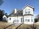 Exterior backyard view of the home and stone patio at 1662 Maple Trace Ct, Grayson, GA 30017