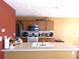 Well-lit kitchen with wood cabinets and a spacious countertop perfect for meal preparation and casual dining at 1662 Maple Trace Ct, Grayson, GA 30017