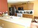 Modern kitchen featuring stainless steel appliances, ample cabinet space, and a bright countertop for cooking and entertaining at 1662 Maple Trace Ct, Grayson, GA 30017
