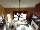 Bright living room featuring a fireplace, large sectional sofa, and decorative rug at 1662 Maple Trace Ct, Grayson, GA 30017