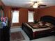 Comfortable main bedroom with ceiling fan, and decorative rug at 1662 Maple Trace Ct, Grayson, GA 30017