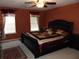 Comfortable main bedroom with ceiling fan, and decorative rug at 1662 Maple Trace Ct, Grayson, GA 30017