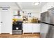 Cozy kitchen showcasing stainless steel appliances and modern lighting at 2285 Peachtree Rd Ne # 803, Atlanta, GA 30309
