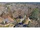 Aerial view of the home surrounded by mature trees and lush landscaping at 2664 Stonebrook Ne Ct, Roswell, GA 30075