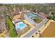 Overhead shot of community tennis courts, pool, lake, and charming pool house at 2664 Stonebrook Ne Ct, Roswell, GA 30075