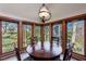 Cozy breakfast nook with large windows offers natural light and attractive views of the wooded landscape at 2664 Stonebrook Ne Ct, Roswell, GA 30075