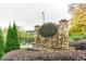 Stone sign displaying 'East Spring Lake' with lush greenery around the entrance at 2664 Stonebrook Ne Ct, Roswell, GA 30075