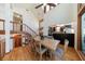 Open dining area features hardwood floors, cathedral ceilings, and an adjacent kitchen and stairway at 2664 Stonebrook Ne Ct, Roswell, GA 30075