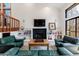 Bright living room features a fireplace, hardwood floors, built-in shelves, and lots of natural light at 2664 Stonebrook Ne Ct, Roswell, GA 30075