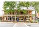 Charming two-story shops with inviting outdoor seating along a brick sidewalk at 2664 Stonebrook Ne Ct, Roswell, GA 30075