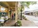Charming street view with brick sidewalks, storefronts, and outdoor seating, creating a welcoming community atmosphere at 2664 Stonebrook Ne Ct, Roswell, GA 30075