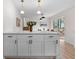 Stylish kitchen island with white cabinets, modern hardware, and ample storage space at 6710 Hidden Brook Trl, Atlanta, GA 30349