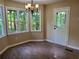 Inviting dining area with modern chandelier and views of the backyard at 195 Baggett Cir, Dallas, GA 30157