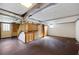 Unfinished basement featuring paneled walls, exposed ducts, stairs, and an exterior door at 2251 Trailwood Se Dr, Smyrna, GA 30080