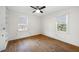 Well-lit bedroom features hardwood floors and two windows allowing for natural light at 2251 Trailwood Se Dr, Smyrna, GA 30080